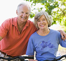 Photo of a man and woman on bicycles. Link to Life Stage Gift Planner Ages 60-70 Situations. Photo of a man and woman on bicycles. Link to Life Stage Gift Planner Ages 60-70 Situations.